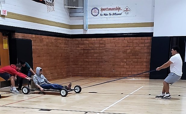 Physical Science and HS STEAM  tested out the rubber band powered cars they engineered  from scratch.  Students had the option to either wind the rubber band on an axel, or sling shoot their car, to make it run.  Then they were able to calculate the speed and acceleration of their design.