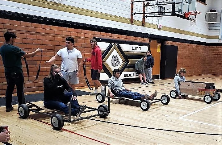 Physical Science and HS STEAM  tested out the rubber band powered cars they engineered  from scratch.  Students had the option to either wind the rubber band on an axel, or sling shoot their car, to make it run.  Then they were able to calculate the speed and acceleration of their design.