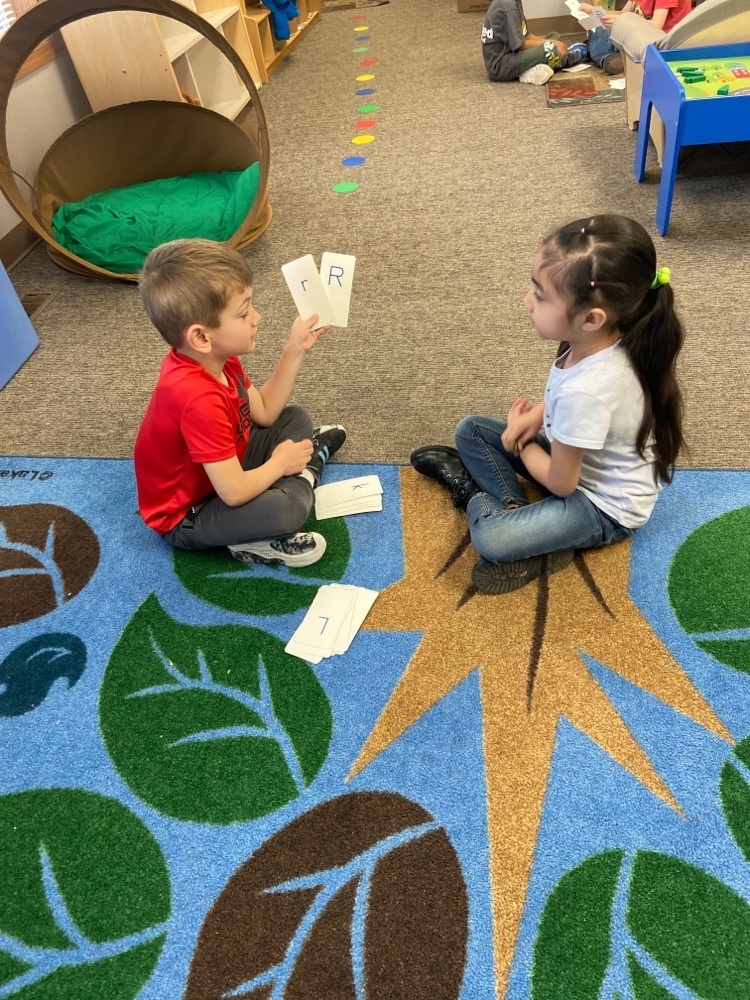 Pre-k class studied their letters and sounds in groups of two.