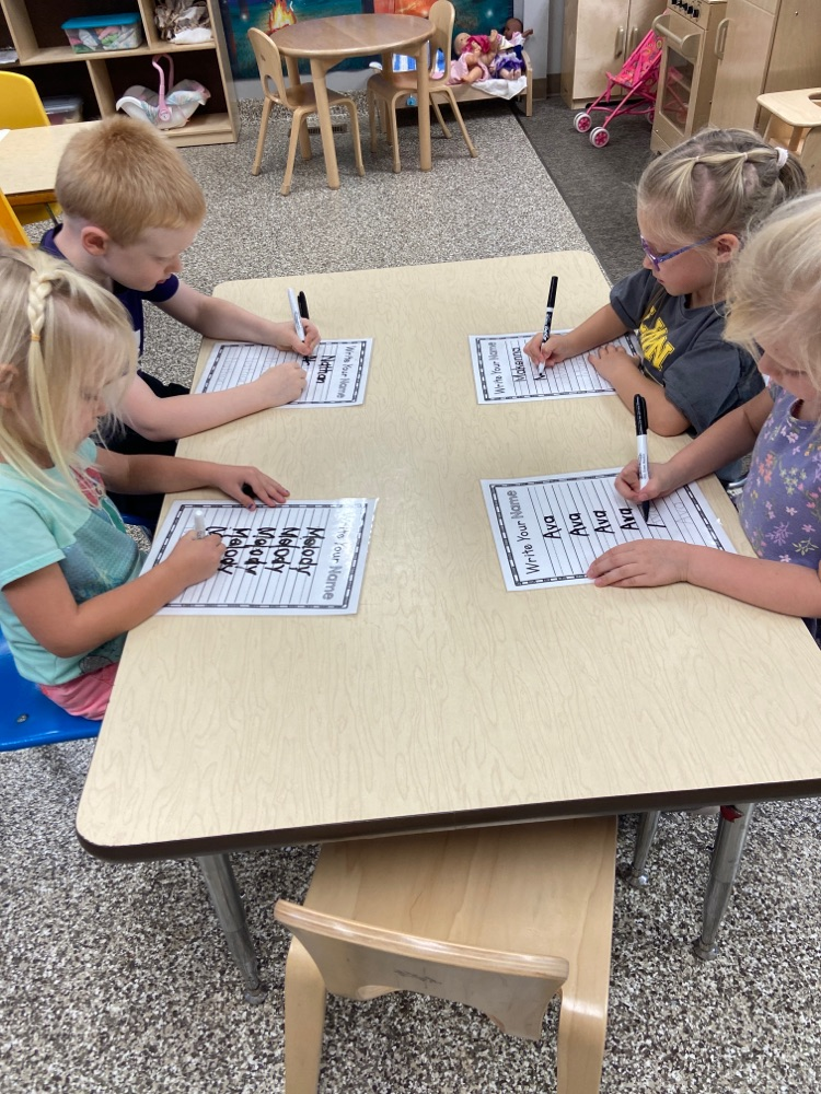 Pre-k class is busy working on reviewing tracing their first names. 